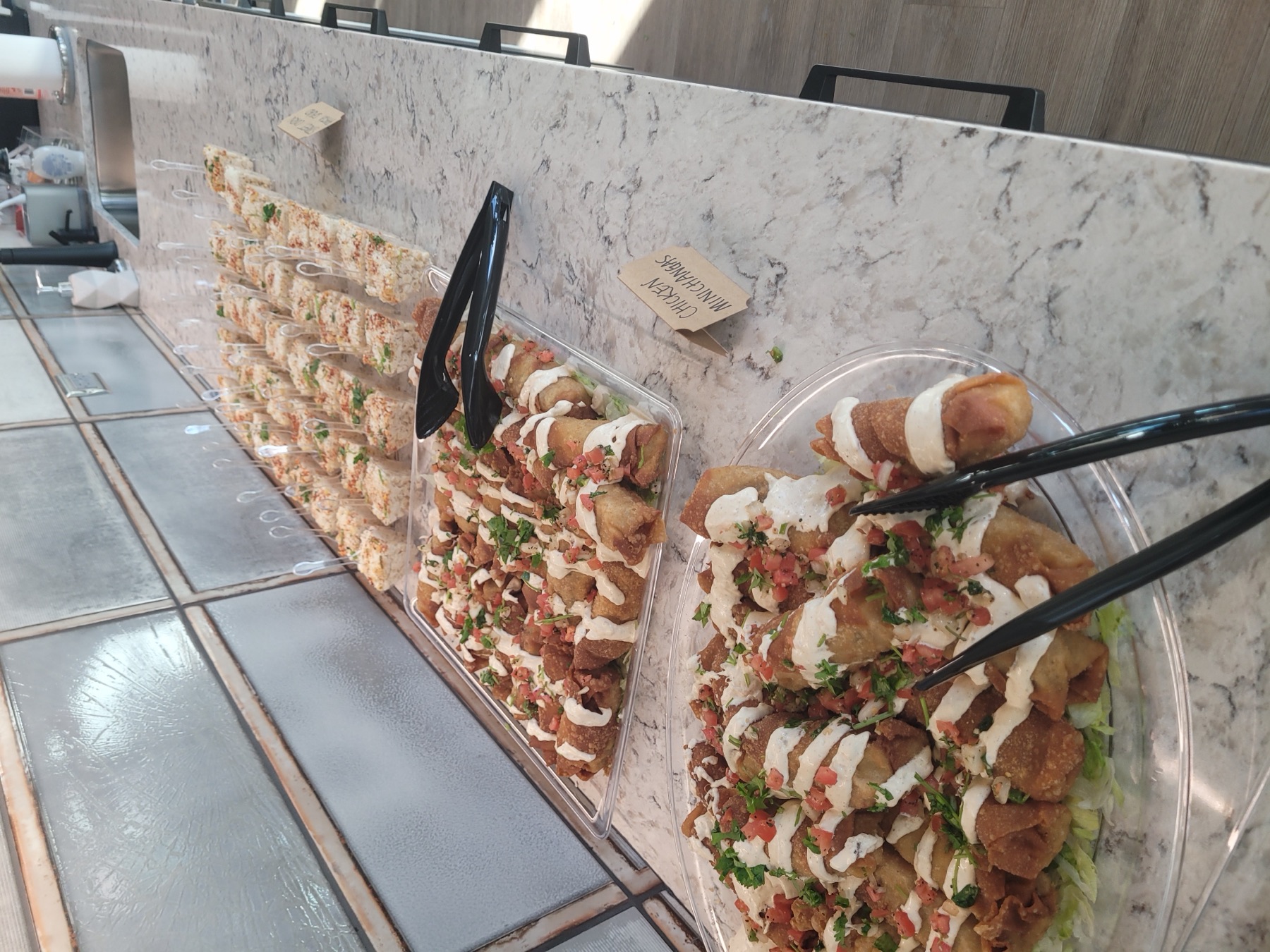 Chicken MiniChangas topped with crema and pico de gallo